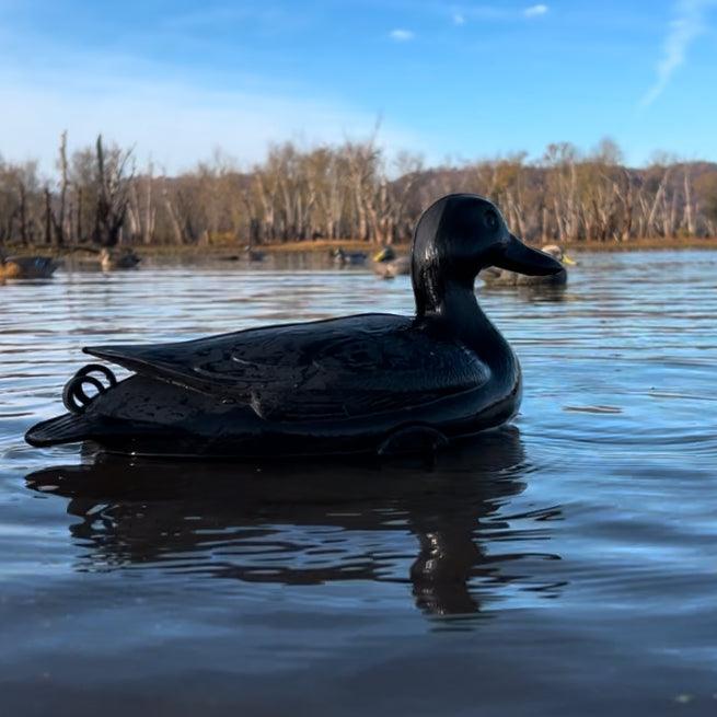 Matte Black Jahpoo Flyway Deputy Motion Duck Decoy in open water